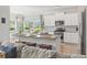 Spacious kitchen island with seating, granite countertops, stainless steel appliances, and modern design at 519 Royal Jay Ln., Longs, SC 29568