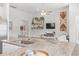 Open-concept kitchen with granite countertops, stainless steel appliances, and a view into the living area at 519 Royal Jay Ln., Longs, SC 29568