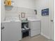 Bright laundry room featuring a washer and dryer, plus storage at 519 Royal Jay Ln., Longs, SC 29568