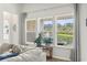 Bright living room with view of backyard pond, fountain, and lots of nature at 519 Royal Jay Ln., Longs, SC 29568