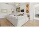 Bright living room featuring hardwood floors, sectional sofa, and stylish accents at 519 Royal Jay Ln., Longs, SC 29568