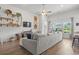 Cozy living room with hardwood floors, large sectional, and stylish decor at 519 Royal Jay Ln., Longs, SC 29568