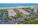 Stunning aerial view of an oceanfront condo complex with a pool, lush landscaping, and convenient parking at 5601 N Ocean Blvd. # A-307, Myrtle Beach, SC 29577