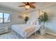 Cozy bedroom with a large window, air conditioner, and decorated bedside table at 5601 N Ocean Blvd. # A-307, Myrtle Beach, SC 29577