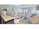 Cozy living room with stylish furnishings, a dining area, and a view through sliding doors to a private balcony at 5601 N Ocean Blvd. # A-307, Myrtle Beach, SC 29577