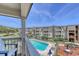 Balcony view of a pool and lush landscaping at this condo community at 5601 N Ocean Blvd. # A-307, Myrtle Beach, SC 29577