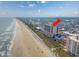 Expansive aerial view of the building highlighting its beachfront location and community at 5700 N Ocean Blvd. # Ph12, North Myrtle Beach, SC 29582