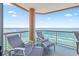 This condo boasts a cozy balcony with seating, a small table, and panoramic views of the ocean at 5700 N Ocean Blvd. # Ph12, North Myrtle Beach, SC 29582