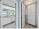 View of the bathroom with double vanity, plus walk-in closet with ample storage at 5700 N Ocean Blvd. # Ph12, North Myrtle Beach, SC 29582
