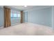 Spacious bedroom with a neutral color scheme, carpet, and an ocean view at 5700 N Ocean Blvd. # Ph12, North Myrtle Beach, SC 29582