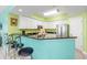 Modern kitchen with stainless steel appliances and breakfast bar seating at 5700 N Ocean Blvd. # Ph12, North Myrtle Beach, SC 29582