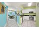 Open floor plan featuring kitchen with breakfast bar overlooking living area at 5700 N Ocean Blvd. # Ph12, North Myrtle Beach, SC 29582