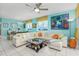 Comfortable living room featuring large sectional couch and ocean views at 5700 N Ocean Blvd. # Ph12, North Myrtle Beach, SC 29582