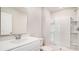 Clean and bright bathroom with a modern vanity, toilet, and a stand-up shower with white tile at 575 Strawberry Field Way, Galivants Ferry, SC 29544