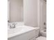 Clean bathroom features a white vanity with chrome faucet, toilet, and shower-tub combo at 575 Strawberry Field Way, Galivants Ferry, SC 29544