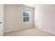 Inviting bedroom with plush neutral carpet, fresh paint, window, and white trim providing a cozy and bright space at 575 Strawberry Field Way, Galivants Ferry, SC 29544