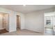 Inviting bedroom with soft carpeting and convenient access to an ensuite bathroom and a closet at 575 Strawberry Field Way, Galivants Ferry, SC 29544