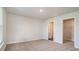 Comfortable bedroom with plush carpeting and access to ensuite bathroom and a walk-in closet at 575 Strawberry Field Way, Galivants Ferry, SC 29544
