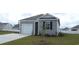 Charming one-story home with attached garage, well-manicured lawn, and a welcoming entrance at 575 Strawberry Field Way, Galivants Ferry, SC 29544