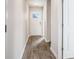 Inviting hallway with wood-look flooring, leading to various rooms within the house at 575 Strawberry Field Way, Galivants Ferry, SC 29544