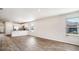 Spacious living area with a view of the kitchen and dining space, bathed in natural light at 575 Strawberry Field Way, Galivants Ferry, SC 29544