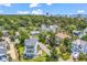 Aerial view of a lovely home with a front-facing garage in a neighborhood with mature trees at 601 46Th Ave. S, North Myrtle Beach, SC 29582