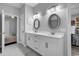 Bathroom featuring double sink vanity, decorative mirrors, and recessed lighting at 601 46Th Ave. S, North Myrtle Beach, SC 29582