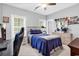 Bedroom featuring natural light, a bed with blue accents, and a work desk at 601 46Th Ave. S, North Myrtle Beach, SC 29582