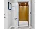 Hallway featuring a residential elevator with wood paneling, providing easy access between floors at 601 46Th Ave. S, North Myrtle Beach, SC 29582
