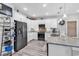 Modern kitchen featuring stainless steel appliances, gray countertops, and white cabinets for a clean aesthetic at 601 46Th Ave. S, North Myrtle Beach, SC 29582