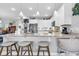Bright kitchen with a granite island, pendant lighting, and seating, perfect for casual dining and entertaining at 601 46Th Ave. S, North Myrtle Beach, SC 29582