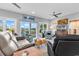 Inviting living room with comfortable seating and large windows with scenic views at 601 46Th Ave. S, North Myrtle Beach, SC 29582