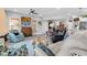 Bright and airy living room featuring a neutral color palette, comfortable seating, and a view of dining area at 601 46Th Ave. S, North Myrtle Beach, SC 29582
