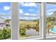 Expansive marsh view with the community swimming pool visible, enjoyed from inside the residence at 601 46Th Ave. S, North Myrtle Beach, SC 29582