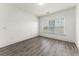 Well-lit bedroom featuring a large window and modern flooring at 6010 Windsor Green Way # 301, Myrtle Beach, SC 29579