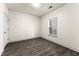 Bright bedroom with wood-look flooring and a window for ample natural light at 6010 Windsor Green Way # 301, Myrtle Beach, SC 29579