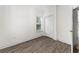 Bright bedroom with wood-look flooring, a window, and a closet for ample storage at 6010 Windsor Green Way # 301, Myrtle Beach, SC 29579