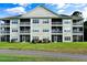Exterior view of a multi-story building featuring private balconies at 6010 Windsor Green Way # 301, Myrtle Beach, SC 29579