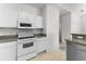 Bright kitchen featuring white appliances, ample cabinet space, and a functional layout at 6010 Windsor Green Way # 301, Myrtle Beach, SC 29579