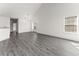 Spacious living room with tall ceilings, gray flooring, and abundant natural light at 6010 Windsor Green Way # 301, Myrtle Beach, SC 29579