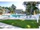 Inviting community pool surrounded by lounge chairs and lush landscaping at 6010 Windsor Green Way # 301, Myrtle Beach, SC 29579