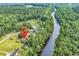 A captivating aerial view of a home with a river nearby offering stunning waterfront access at 6161 Inman Circle, Conway, SC 29526