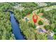 Stunning aerial view of the home, nestled amidst lush greenery and along a scenic river at 6161 Inman Circle, Conway, SC 29526