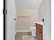 Small bathroom has a wooden vanity, toilet, and towel bar at 6161 Inman Circle, Conway, SC 29526