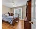 Bedroom with hardwood floors, window with blinds and wood furniture at 6161 Inman Circle, Conway, SC 29526