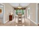 Cozy dining area with large windows, a chandelier, and view of the backyard at 6161 Inman Circle, Conway, SC 29526