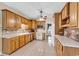 Traditional kitchen with wooden cabinets, white appliances, and tile backsplash at 6161 Inman Circle, Conway, SC 29526