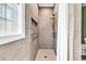 Tiled shower features a built-in niche, grab bars, and shower seat at 6161 Inman Circle, Conway, SC 29526