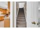 Carpeted stairs lead upwards; kitchen visible at bottom of stairs at 6161 Inman Circle, Conway, SC 29526
