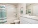 Bright bathroom features a shower-tub combo, white vanity with granite countertop, and coordinating artwork at 651 Culmen Ct., Myrtle Beach, SC 29588
